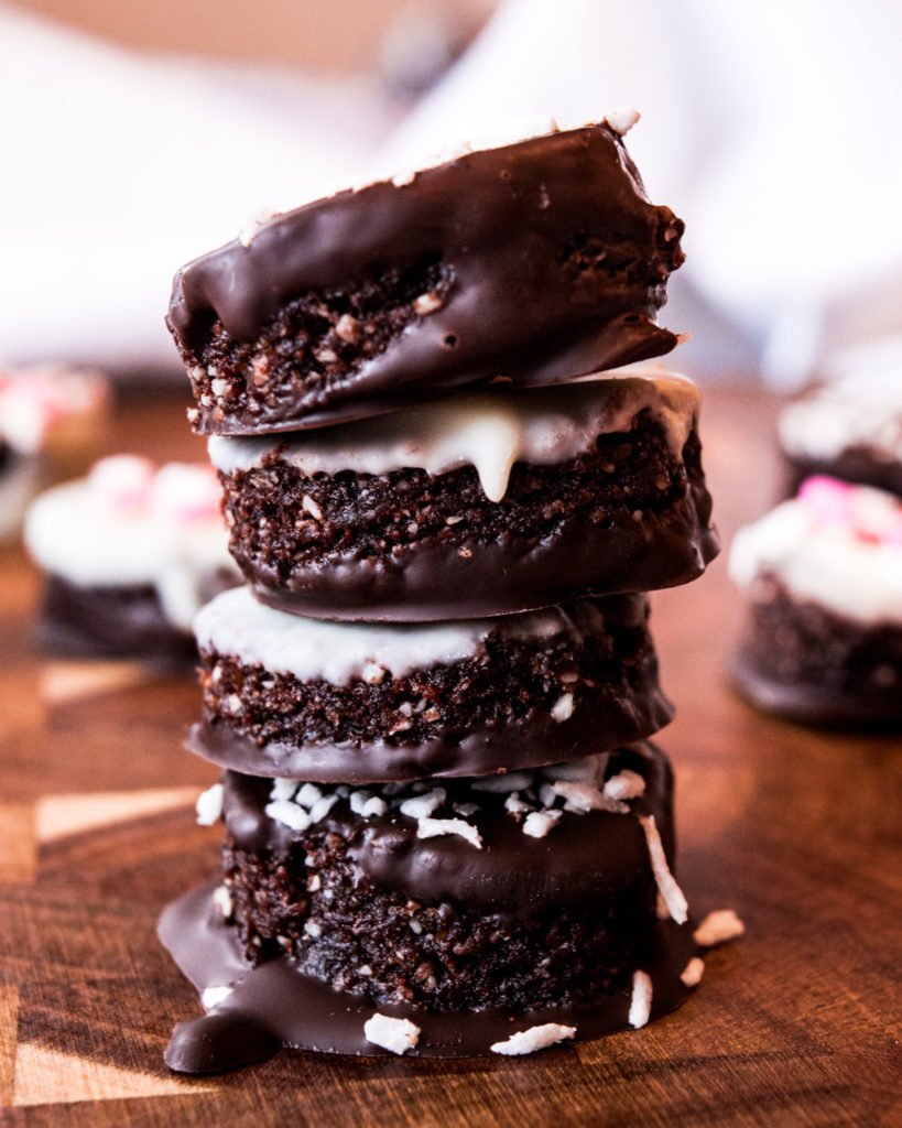 Tower of healthy, no-bake chocolate bites. coated with dark and white chocolate.
